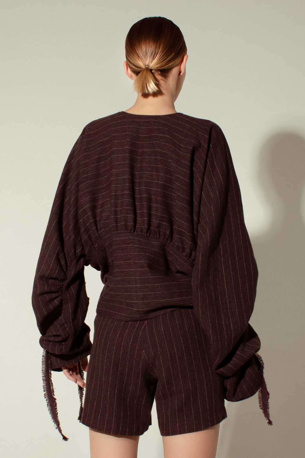 Draped pinstriped wool jacket