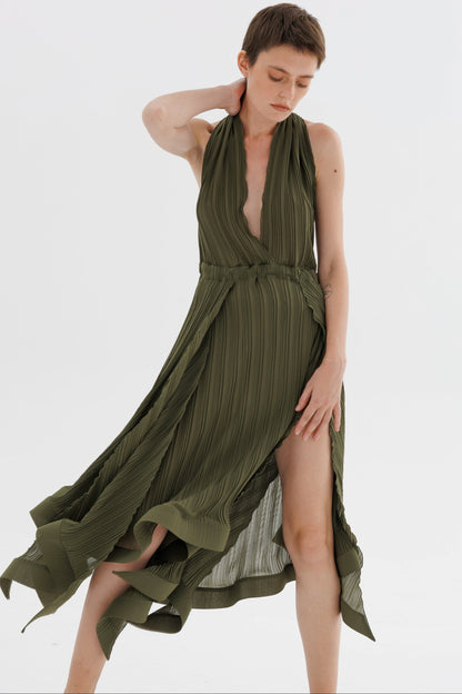 Woman wearing a green dress on a white background